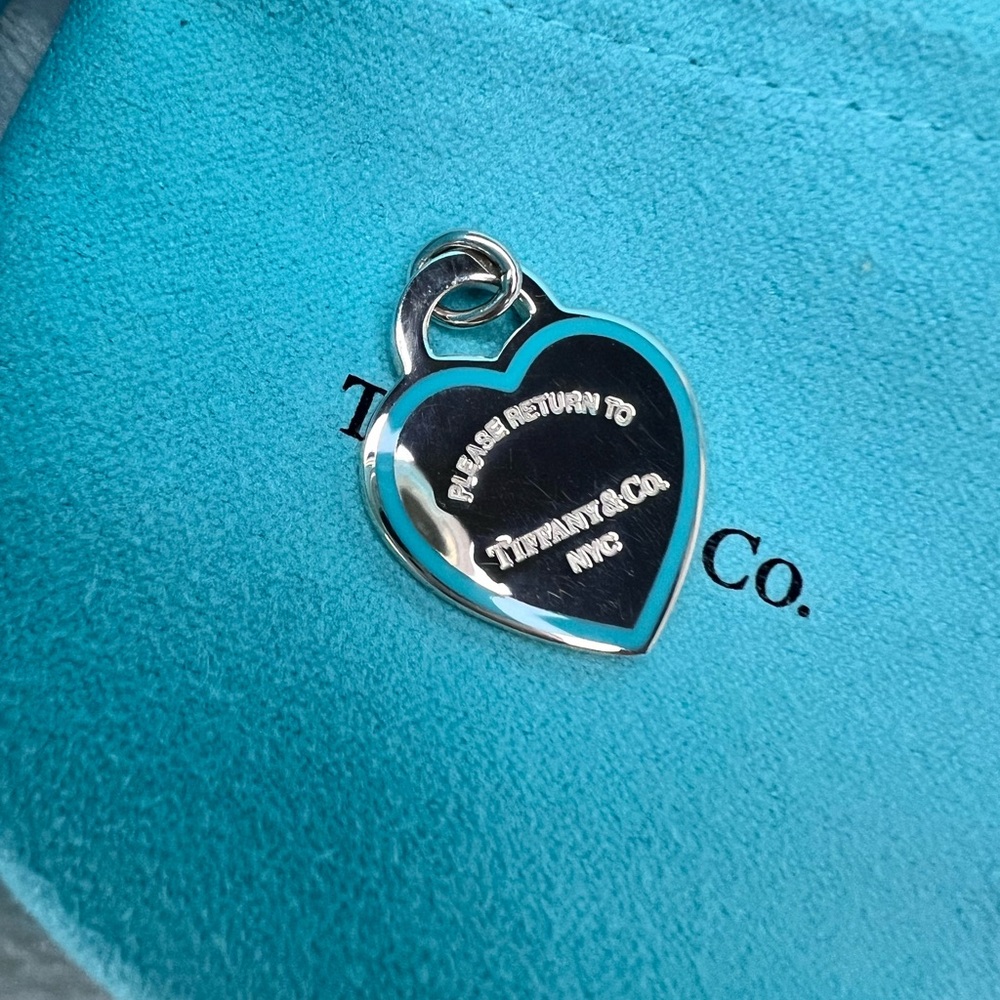 Tiffany & Co. Medium blue border charm.